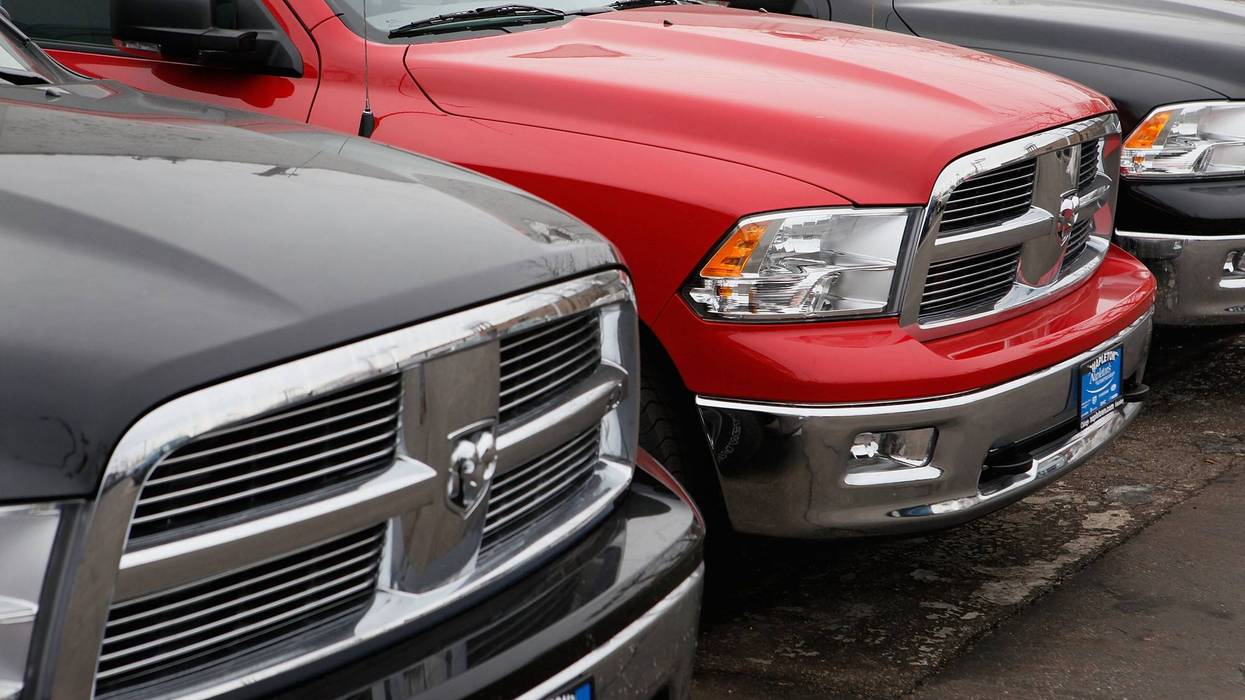 Front ends of Dodge Ram trucks in a row