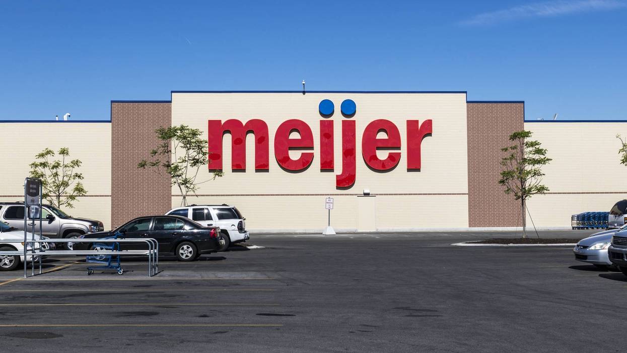 Front of a Meijer store with a prominent red sign and a parking lot.