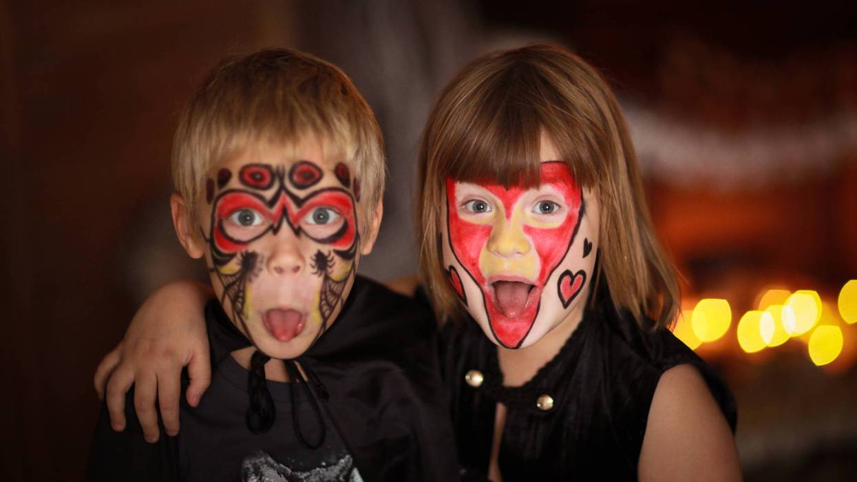 funny scary Children with painted faces, concept of Halloween