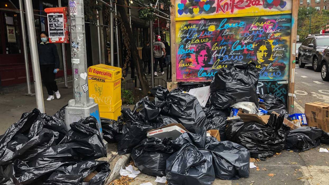 Garbage bags pile up at the corner of Avenue A and 13th Street in the East Village on Oct. 24, 2021