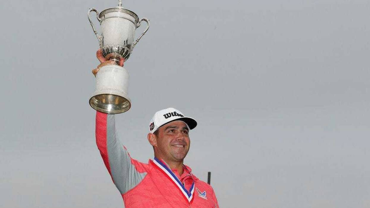 Gary Woodland celebrates with the trophy after winning the U.S. Open Championship golf tournament Sunday, June 16, 2019, in Pebble Beach, Calif.