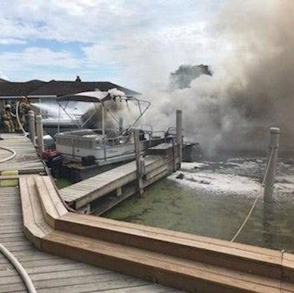 Gas pumps, docks and other boats at a marina in Macomb County narrowly avoided damage after a roaring fire broke out on a vessel Tuesday morning.