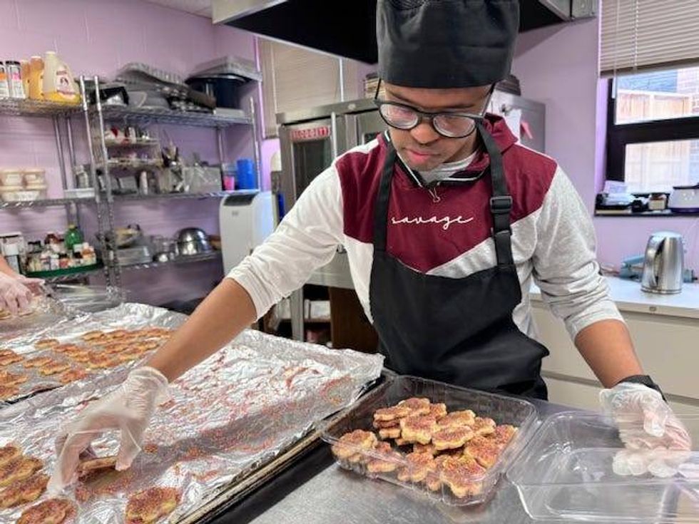 Gateway to Learning worker baking cookies