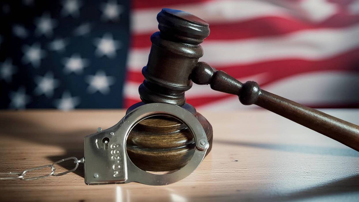 Gavel and handcuffs stock image