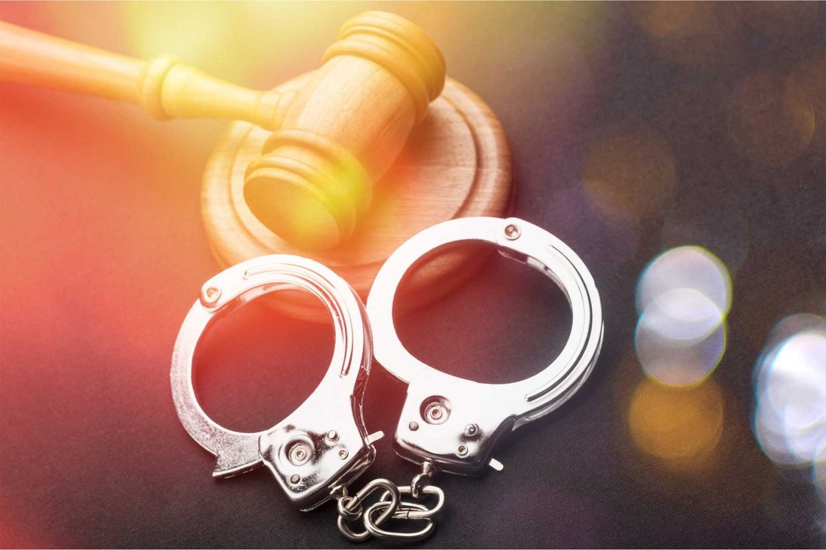 Gavel and handcuffs stock photo.