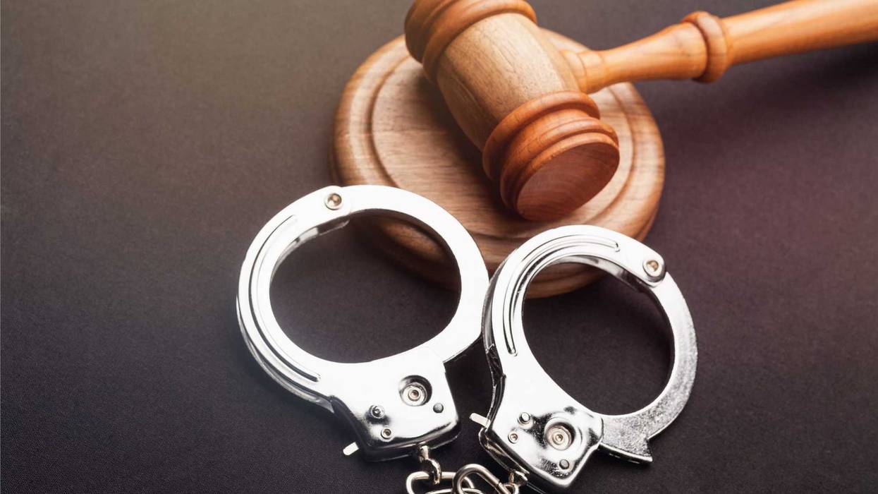 Gavel and handcuffs stock photo.