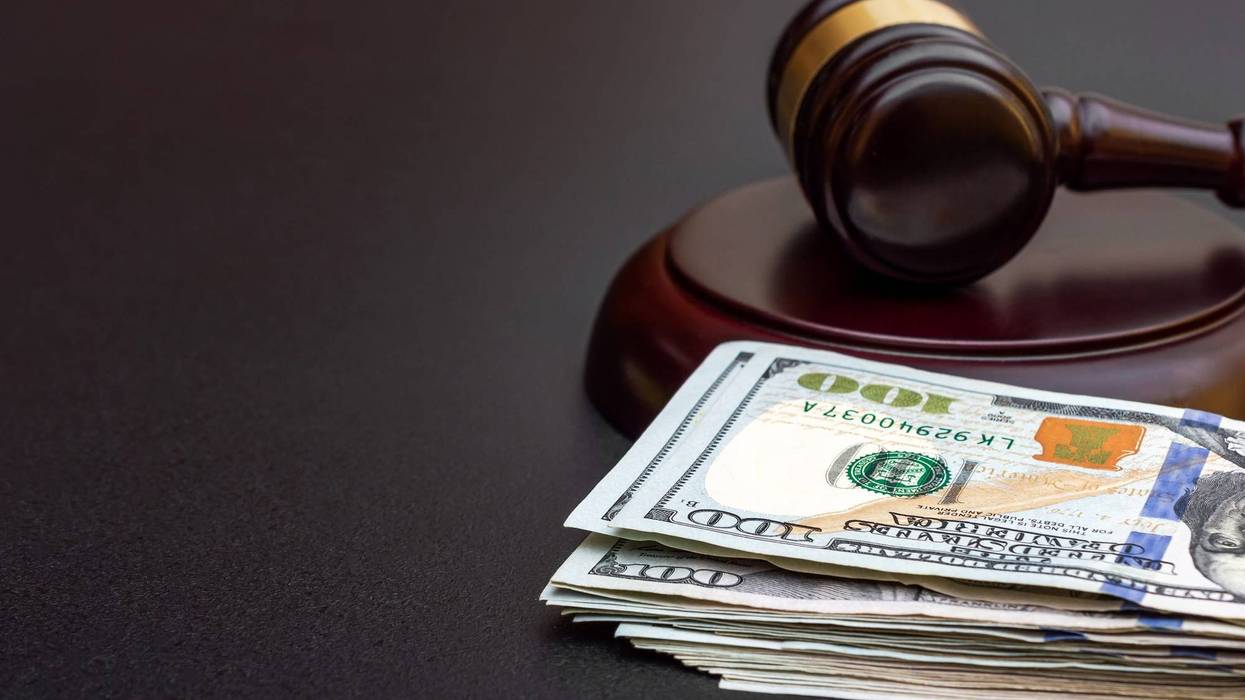 Gavel and stack of $100 bills