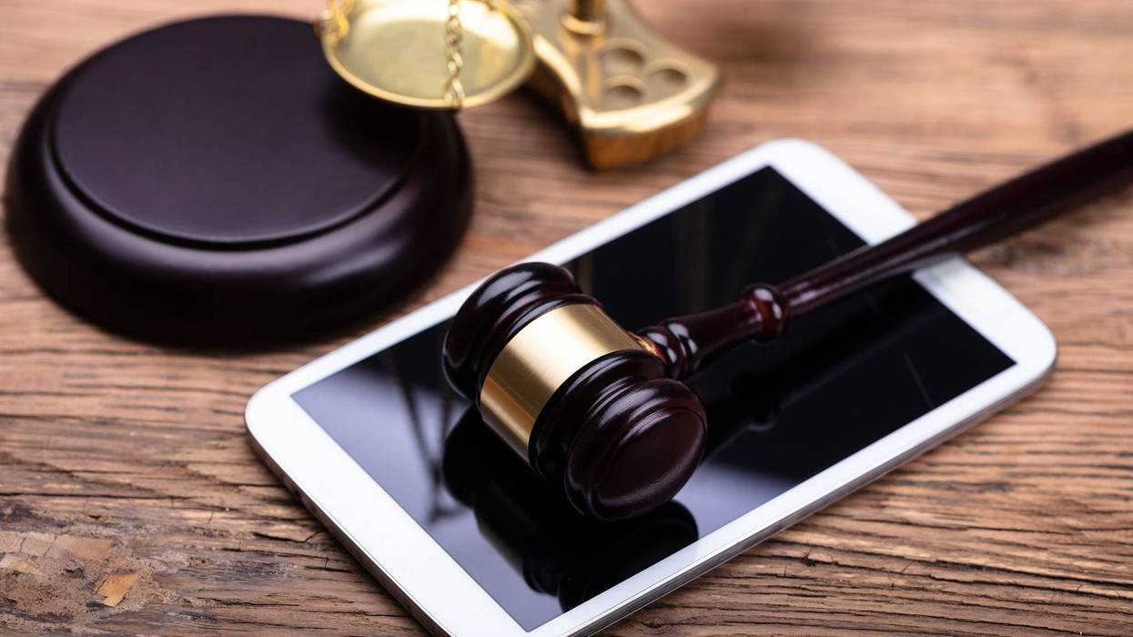 Gavel on top of cell phone