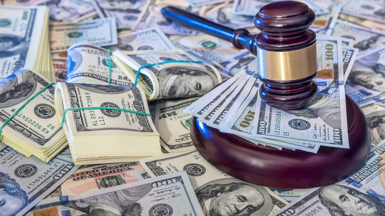 Gavel on top of money