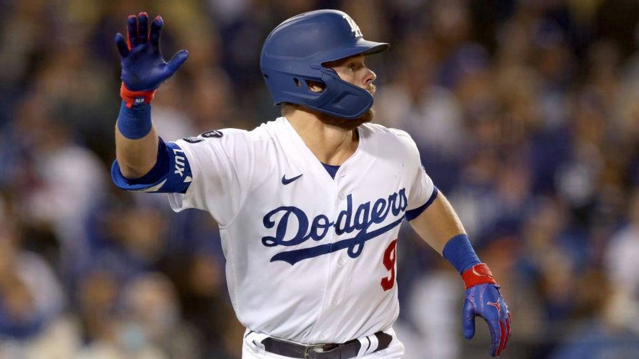Gavin Lux #9 of the Los Angeles Dodgers reacts as he watches the final out of the game against the San Francisco Giants in game 3 of the NLDS.