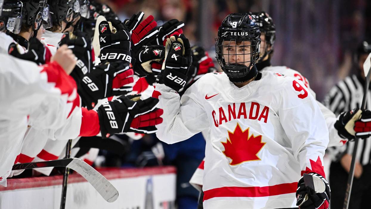 Gavin McKenna of Team Canada celebrates his goal with teammates on the bench during the first period at the 2025 IIHF World Junior Championship against Team Finland at Canadian Tire Centre December 26, 2024 in Ottawa, Ontario, Canada.