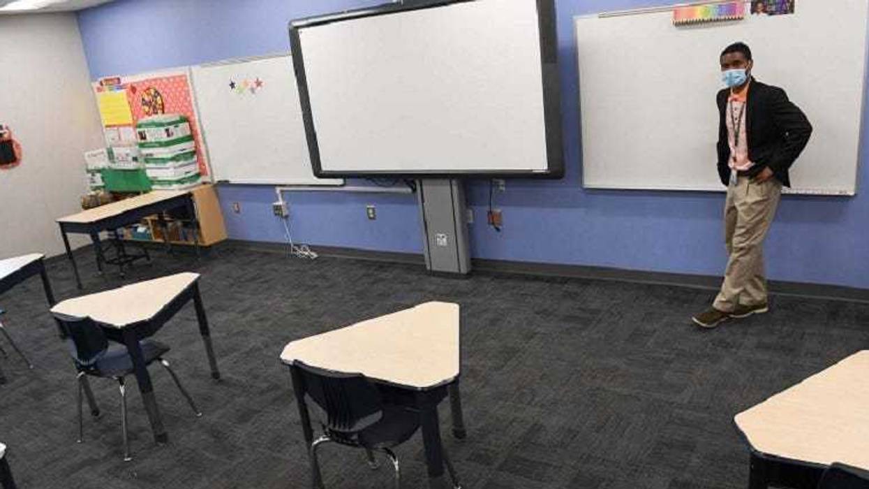 GCS Administrative Assistance Cameron Brice overlooking a socially distanced classroom at A.J. Whittenberg Elementary