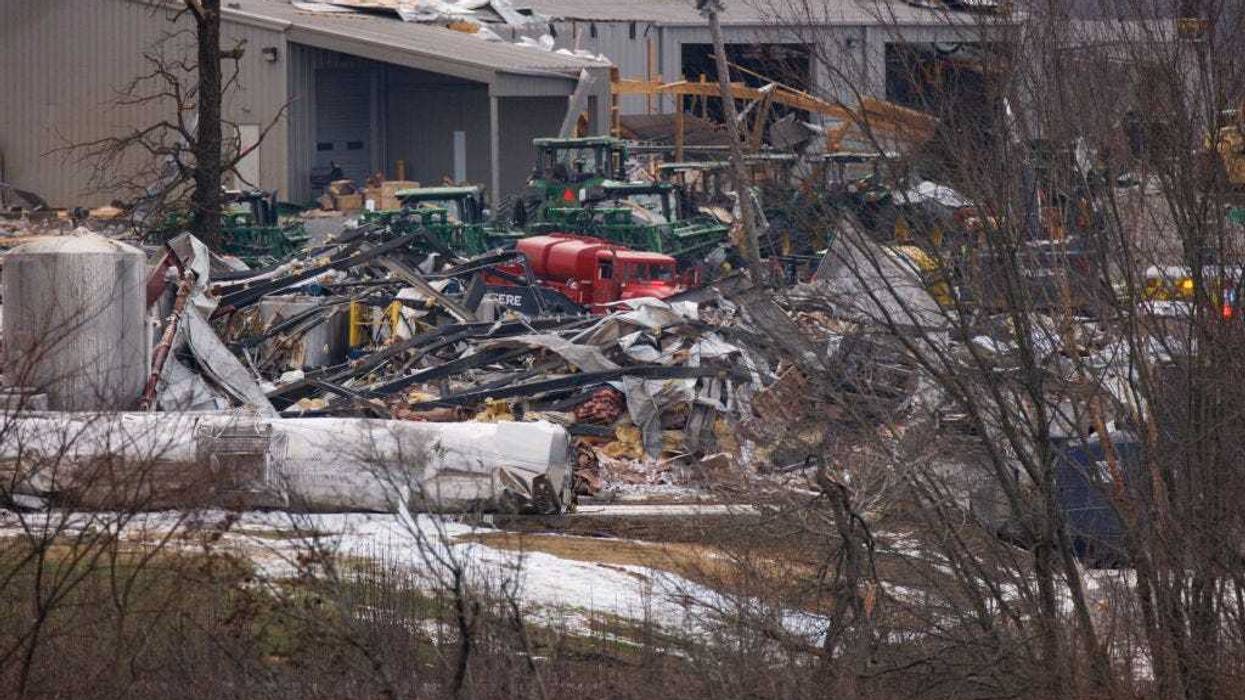 General view of the collapsed Mayfield Consumer Products building (foreground) where workers were present when the tornado came through Friday night on December 11, 2021 in Mayfield, Kentucky. Multiple tornadoes tore through parts of the lower Midwest late on Friday night leaving a large path of destruction. (Photo by Brett Carlsen/Getty Images)