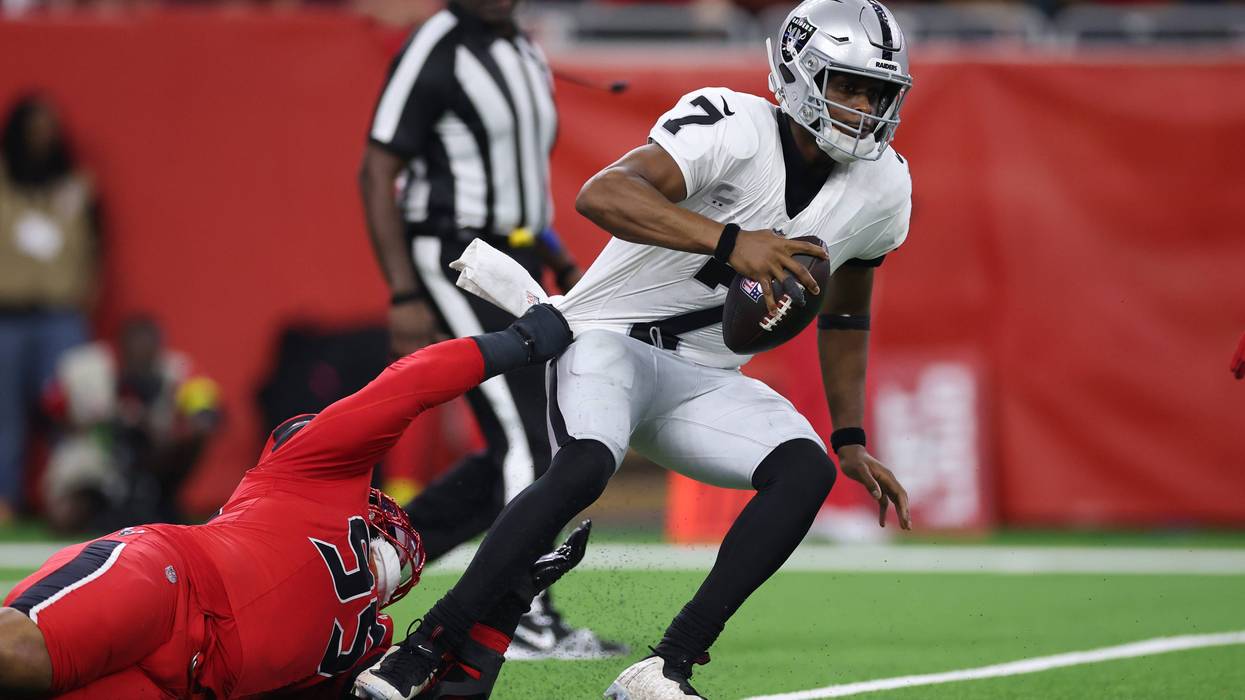 Geno Smith #7 of the Las Vegas Raiders is sacked by Derek Barnett #95 of the Houston Texans during the third quarter at NRG Stadium on December 21, 2025 in Houston, Texas.