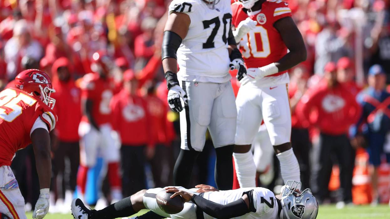 Geno Smith #7 of the Las Vegas Raiders reacts after a sack by Chris Jones #95 of the Kansas City Chiefs during the third quarter in the game at Arrowhead Stadium on October 19, 2025 in Kansas City, Missouri.