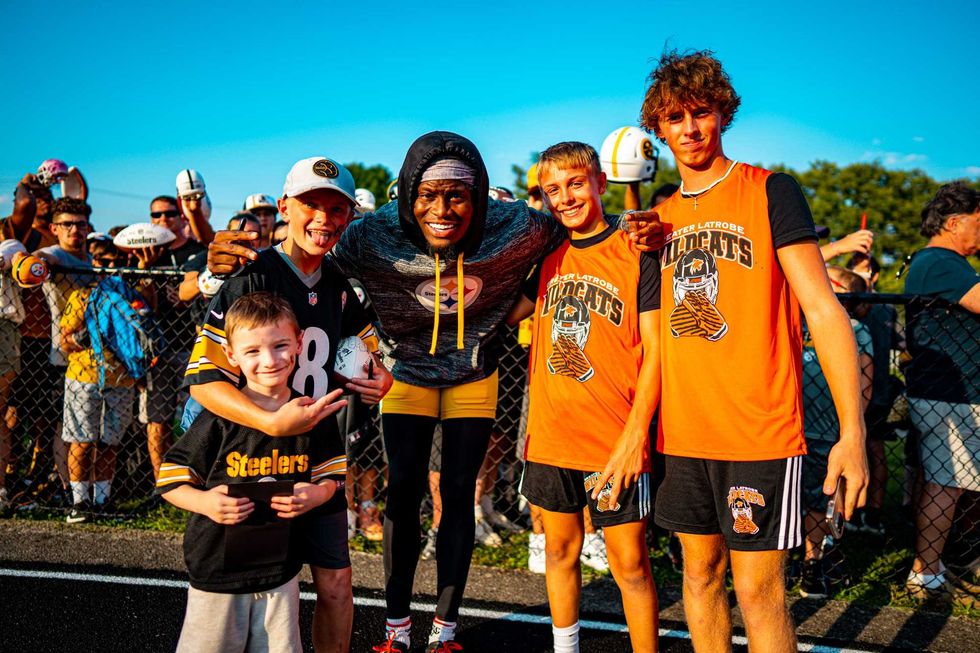 George Pickens poses with fans