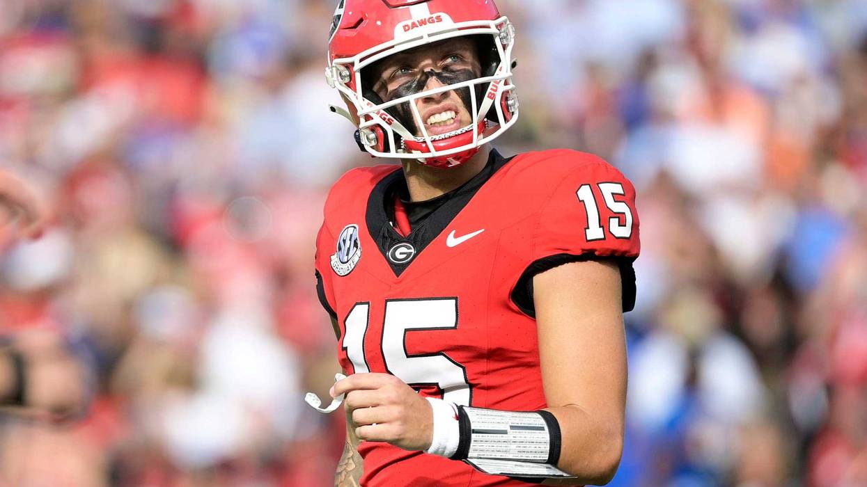 Georgia Bulldogs quarterback Carson Beck (15) reacts after throwing an interception against the Florida Gators during the first quarter at EverBank Stadium.