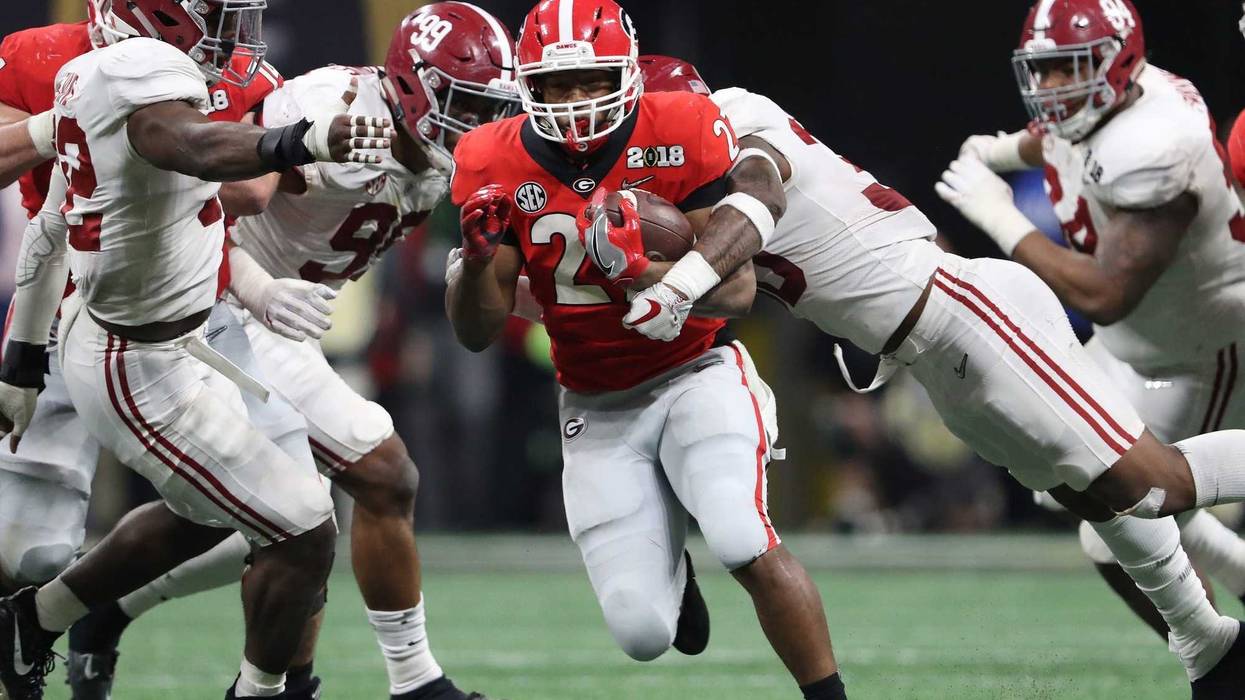 Georgia Bulldogs tailback Nick Chubb (27) runs with the ball against the Alabama Crimson Tide against the in the 2018 CFP national championship college football game at Mercedes-Benz Stadium