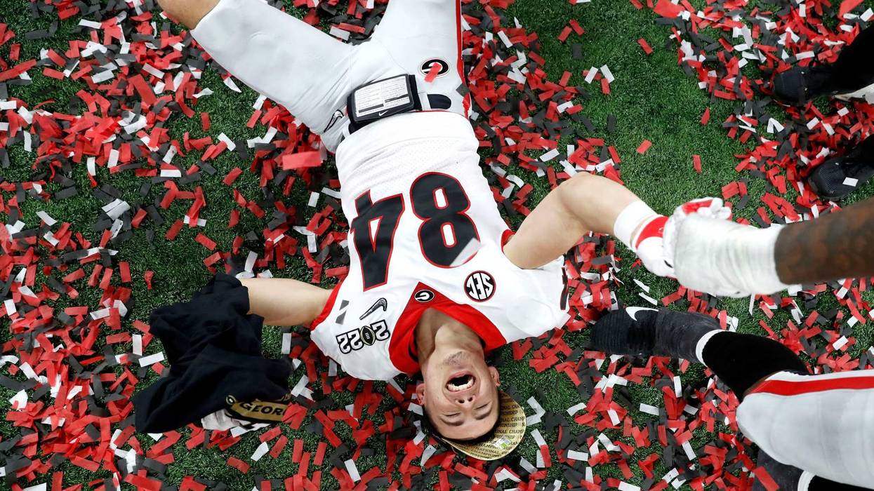 Georgia Bulldogs wide receiver Ladd McConkey (84) celebrates in the confetti after defeating Alabama on Tuesday, Jan. 11, 2022, in the College Football Playoff National Championship at Lucas Oil Stadium in Indianapolis.