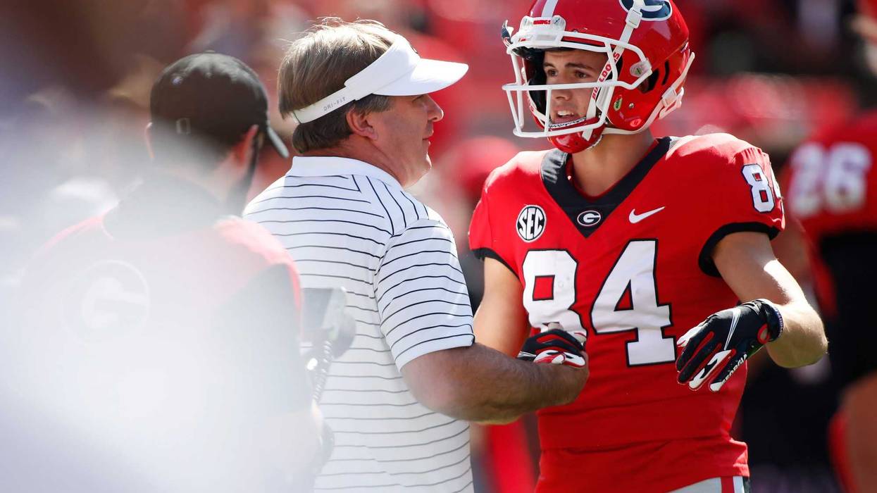Georgia coach Kirby Smart speaks with Georgia Bulldogs wide receiver Ladd McConkey