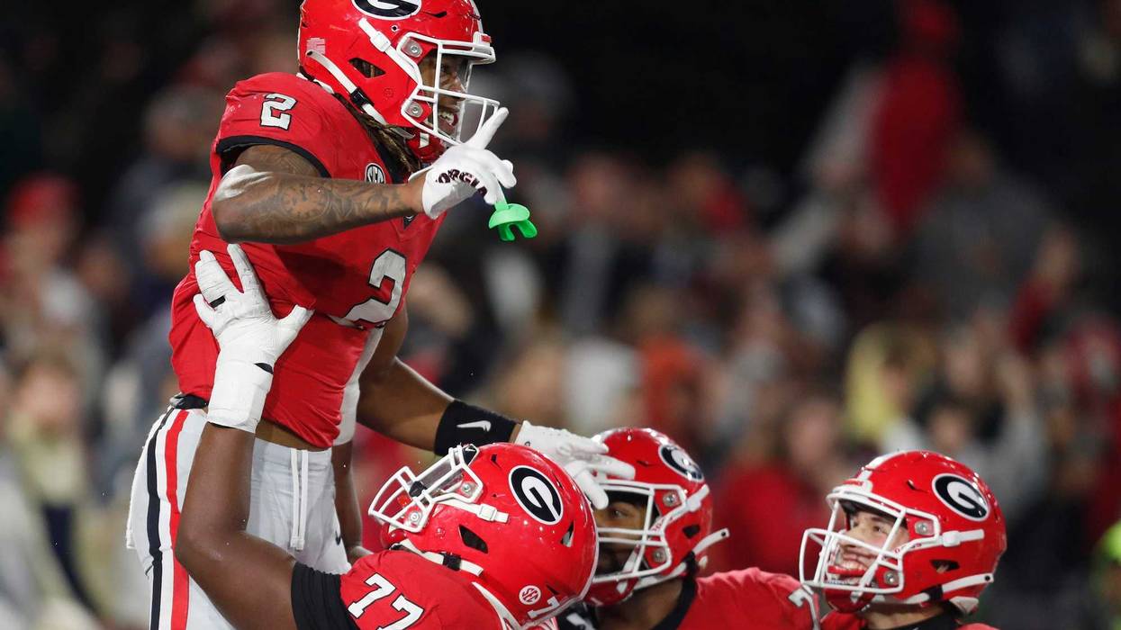 Georgia RB Kendall Milton celebrates with teammates after scoring a TD