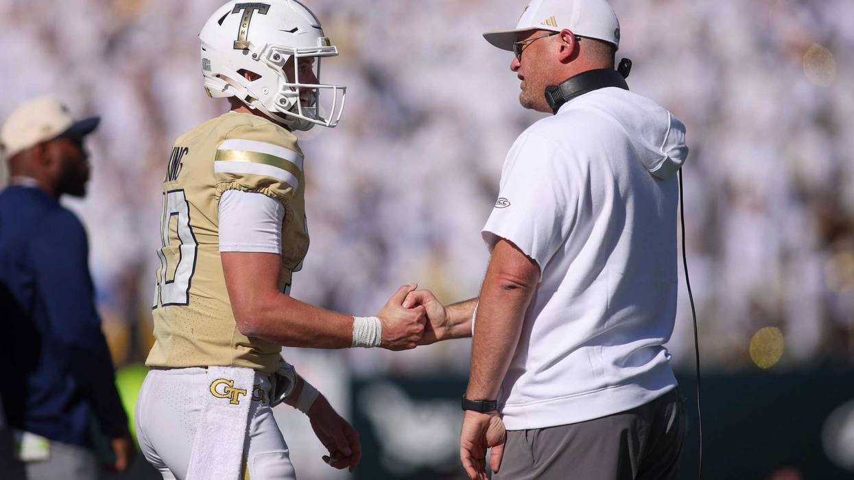 Georgia Tech Yellow Jackets quarterback Haynes King (10) and head coach Brent Key celebrate after at touchdown against the Syracuse Orange