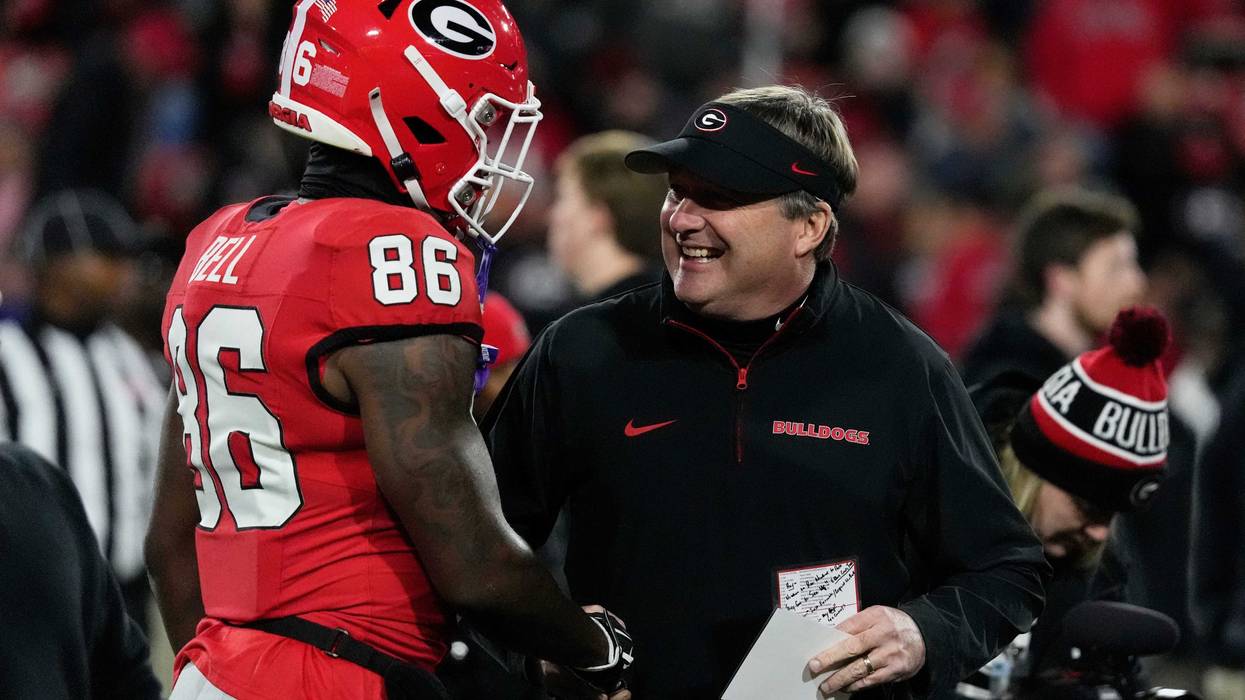 Georgia wide receiver Dillon Bell (86) speaks with Georgia coach Kirby Smart during warm ups before the start of a NCAA college football game against Georgia Tech in Athens, Ga., on Friday, Nov. 29, 2024.