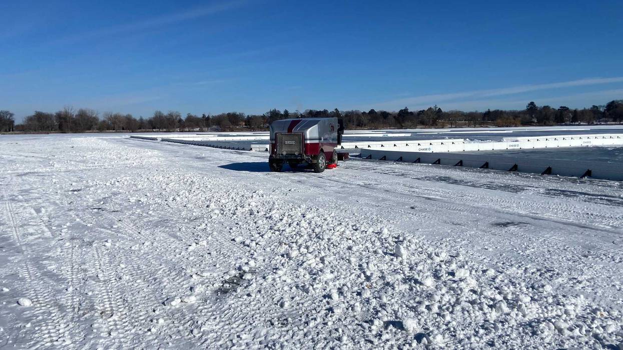 Getting the ice ready for the Pond Hockey Championships on Lake Nokomis on Tuesday.