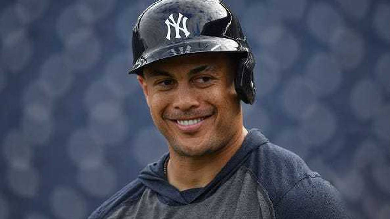 Giancarlo Stanton rounds the bases after hitting a walk off home run against the Seattle Mariners at Yankee Stadium.