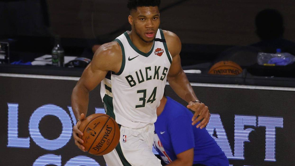 Giannis brings the ball up the court in Game 3