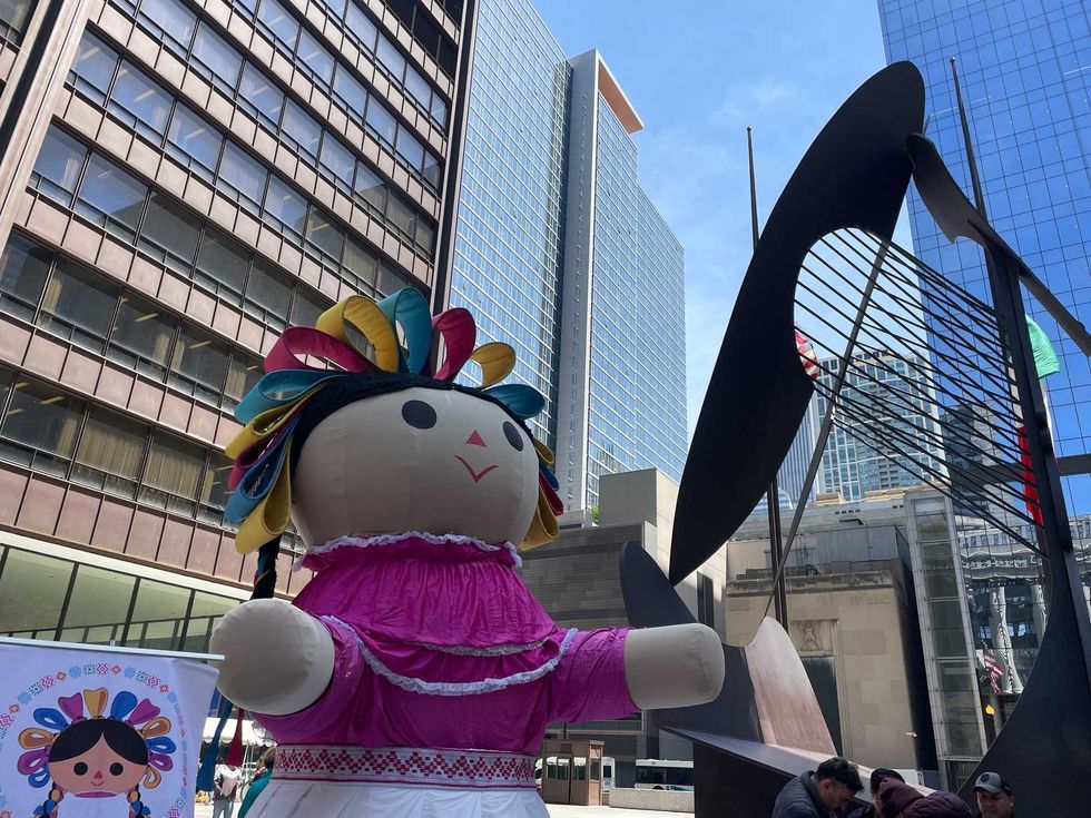 giant doll by Picasso statue
