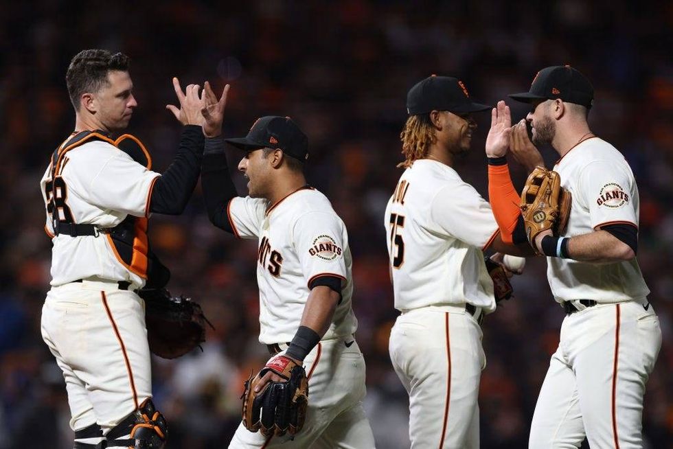 Giants celebrate after defeating the Dodgers.