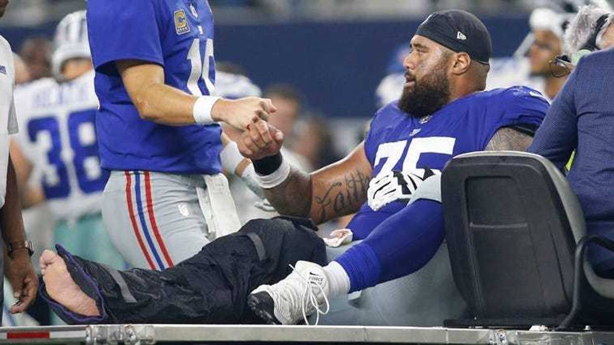 Giants center Jon Halapio is carted off the field after being injured against Dallas Cowboys on Sept. 16, 2018, at AT&T Stadium.