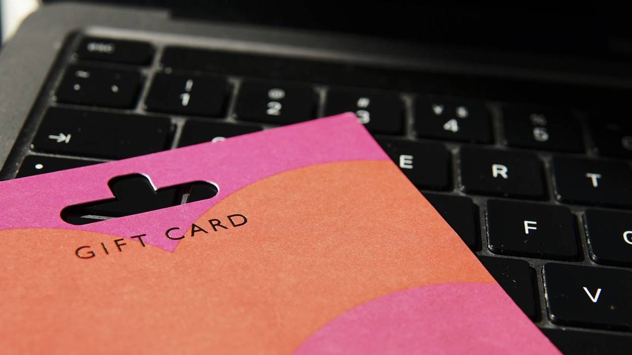 Gift Card on Laptop Keyboard for Online Shopping Concept