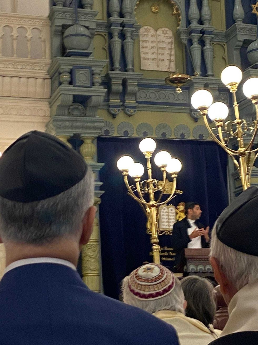 Gili Roman, whose sister was kidnapped and remains in Gaza, speaks at the Park East Synagogue on Manhattan