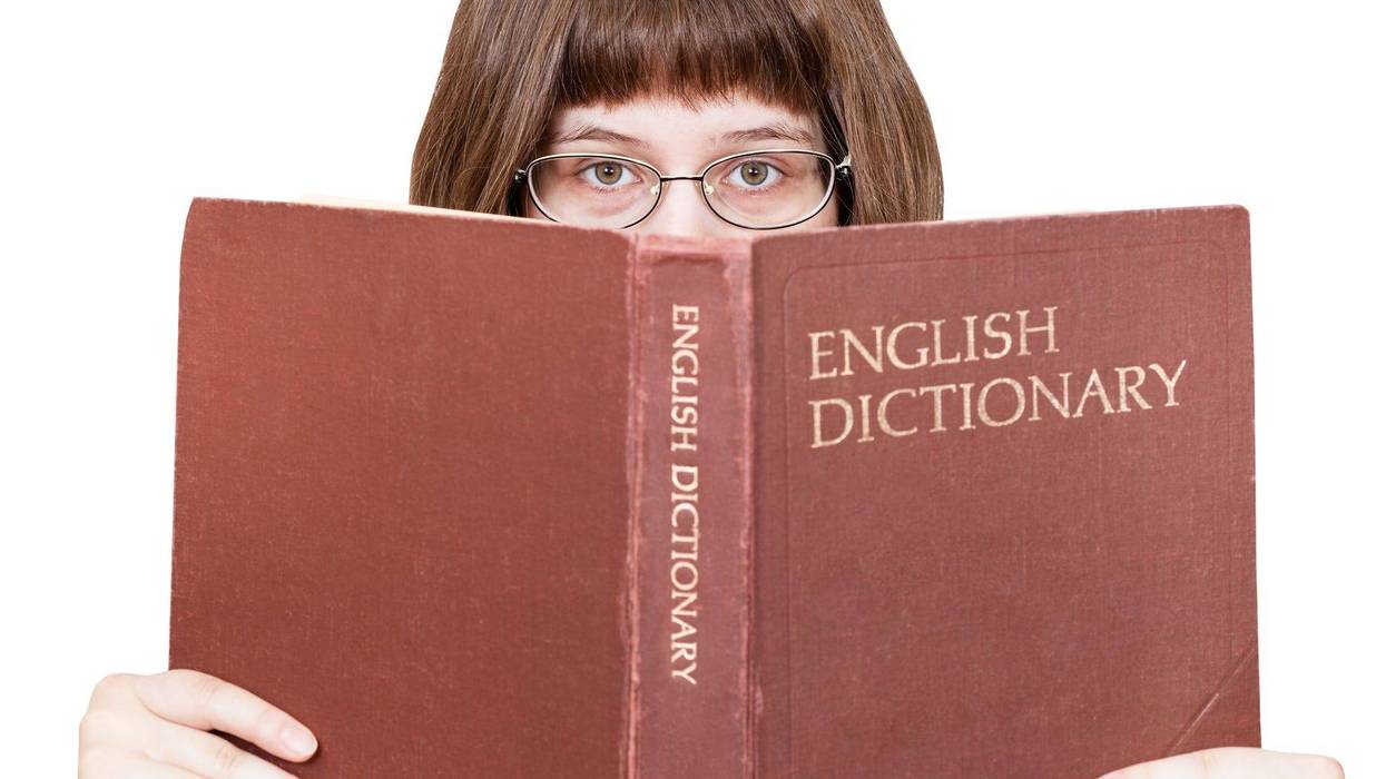 Girl reading dictionary