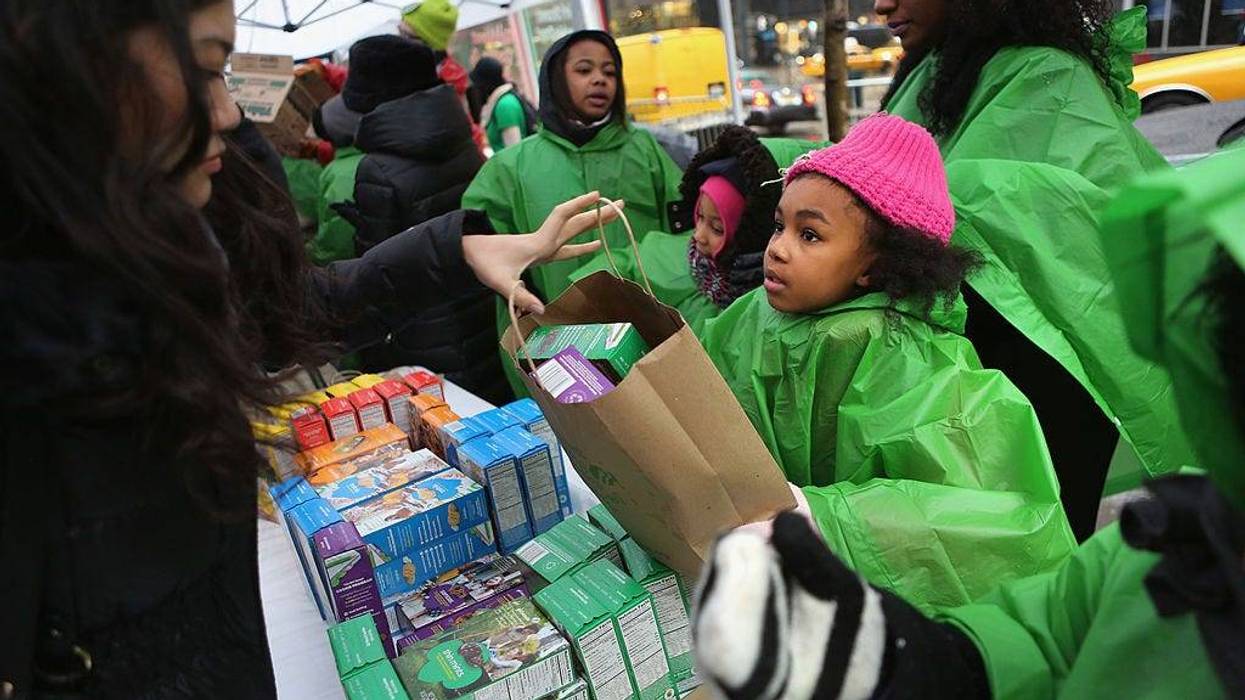 Girl Scouts sell cookies as a winter storm moves in on February 8, 2013 in New York City.