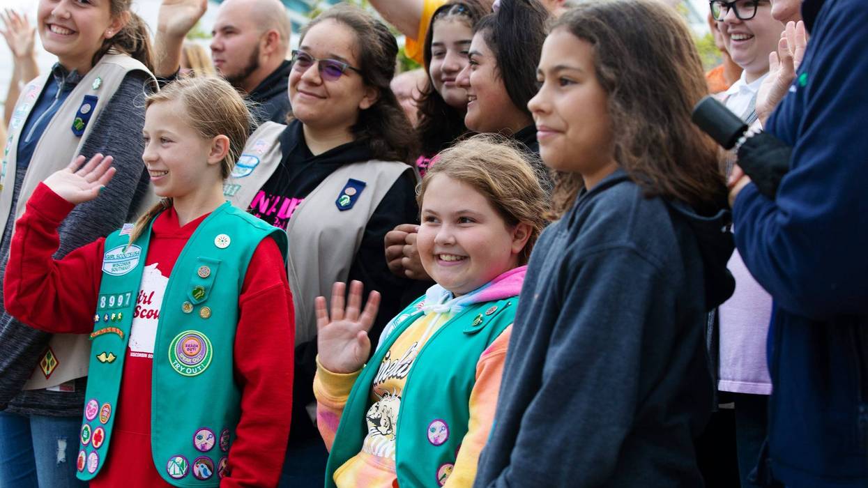 Girl Scouts wave.
