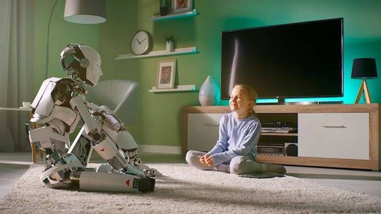 Girl speaking with robot friend at home