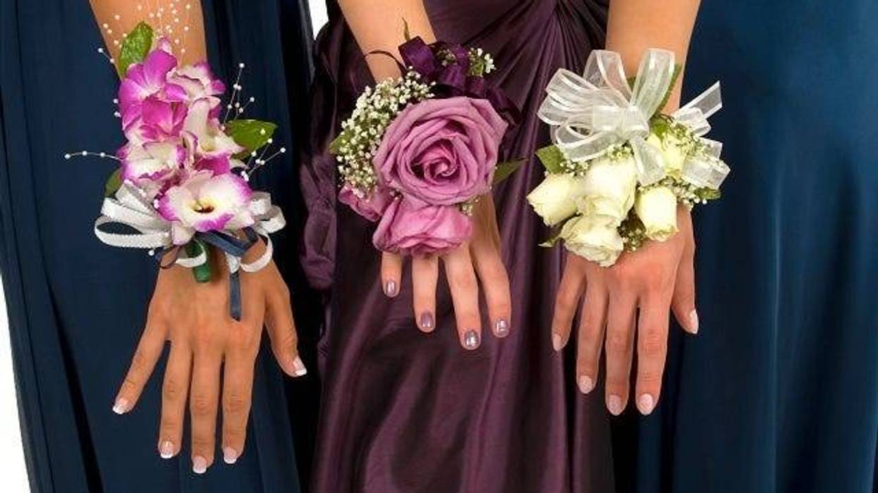 Girls hands wearing corsages for prom