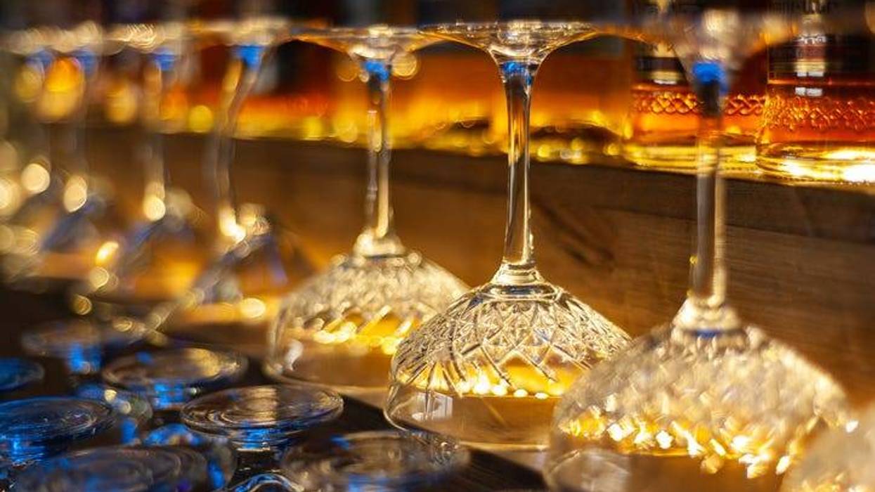 Glass row bar counter . Many empty wineglasses