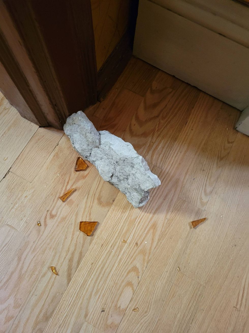 glass shards, with rock on floor
