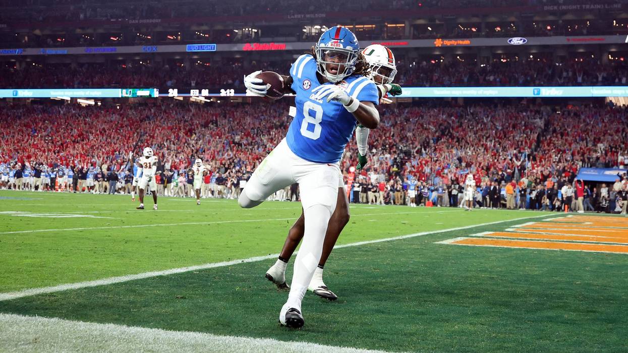 GLENDALE, ARIZONA - JANUARY 08: Dae'quan Wright #8 of the Ole Miss Rebels catches a pass for a touchdown against the Miami Hurricanes during the 2025 College Football Playoff Semifinal at the VRBO Fiesta Bowl at State Farm Stadium on January 08, 2026 in Glendale, Arizona. The Hurricanes defeated the Rebels 31-27.