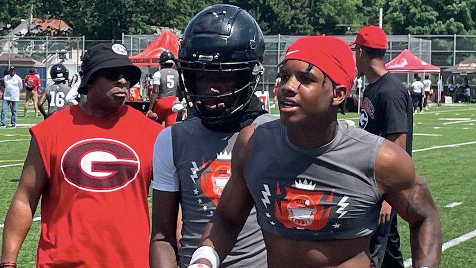 Glenville High School football players leave the field during the Deshaun Watson Foundation Inaugural High School 7-on-7 tournament at Archbishop Hoban High School