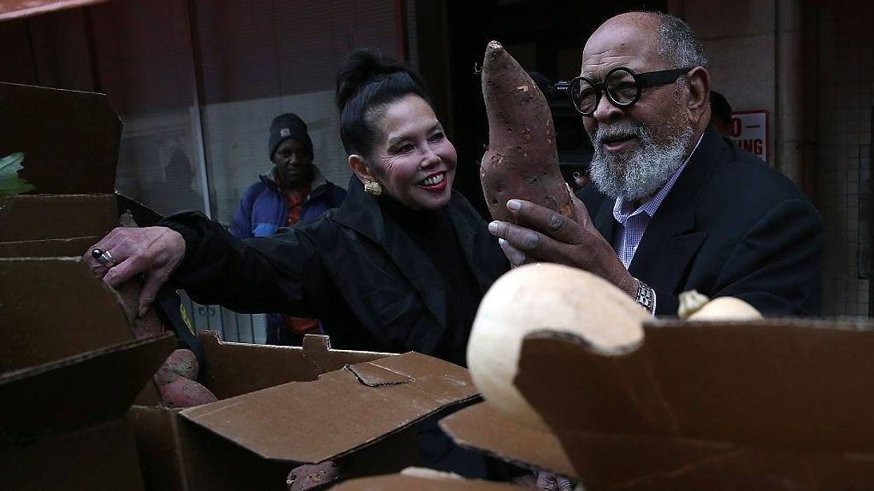 Glide Memorial Church pastor Rev. Cecil Williams (R) and his wife Janice Mirikitani (L) looks at donated produce outside of Glide Memorial Church on November 19, 2014 in San Francisco, California.