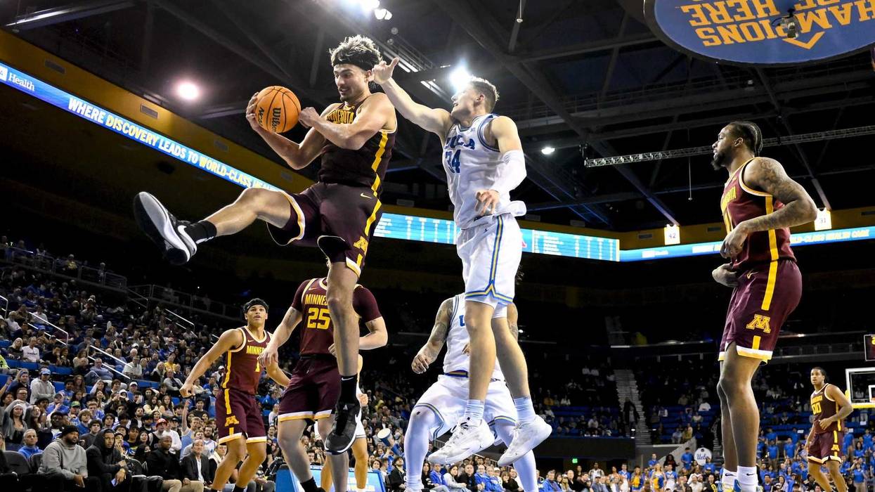 Golden Gophers forward Dawson Garcia (3) grabs a rebound in front of UCLA Bruins forward Tyler Bilodeau (34) during the first half at Pauley Pavilion presented by Wescom.