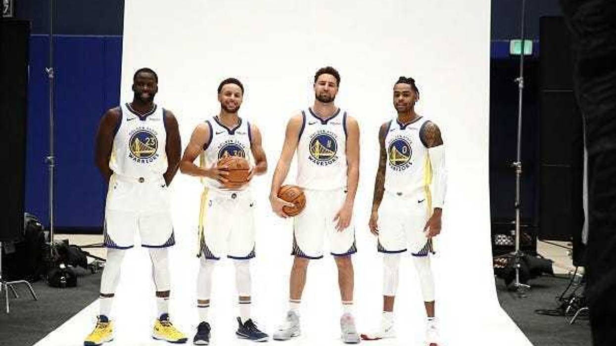 Golden State Warriors guard Klay Thompson (11) reacts with forward Draymond Green (23) and guard Stephen Curry during overtime in Game 1 of the NBA Finals on May 31, 2018, at Oracle Arena in Oakland, California.