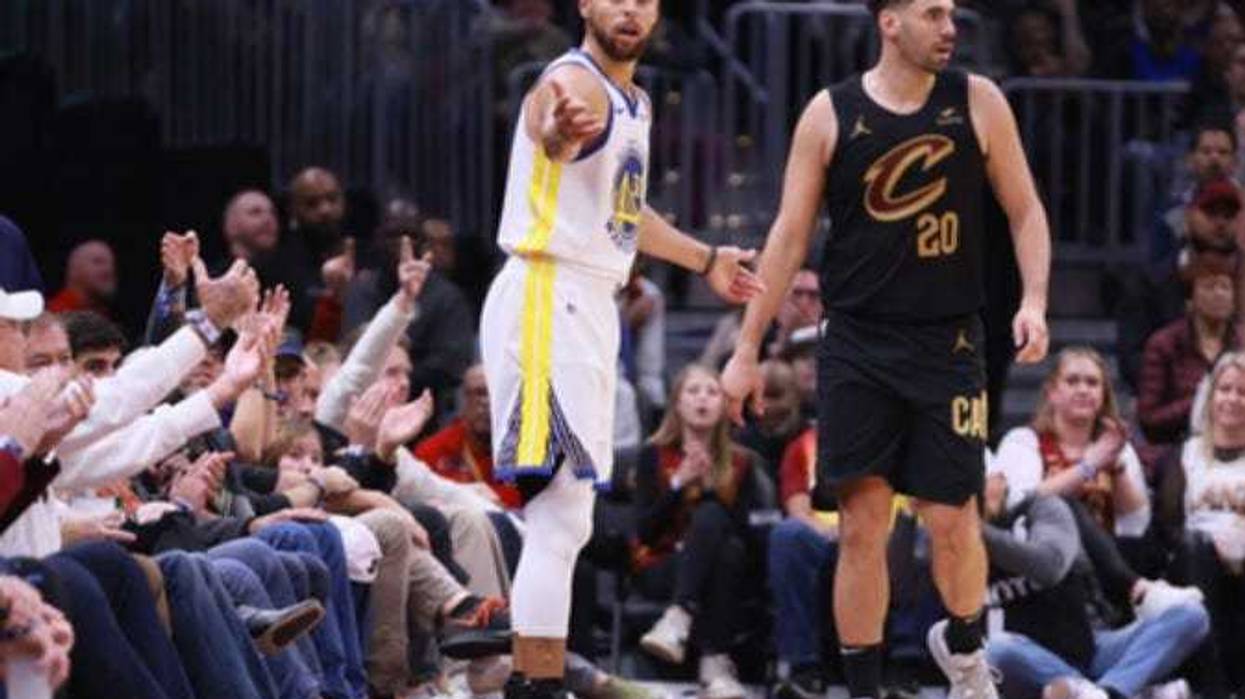 Golden State Warriors guard Steph Curry (30) questions a call after losing a ball out of bounds while defended by Cleveland Cavaliers guard Georges Niang (20) in the second quarter at Rocket Mortgage FieldHouse.