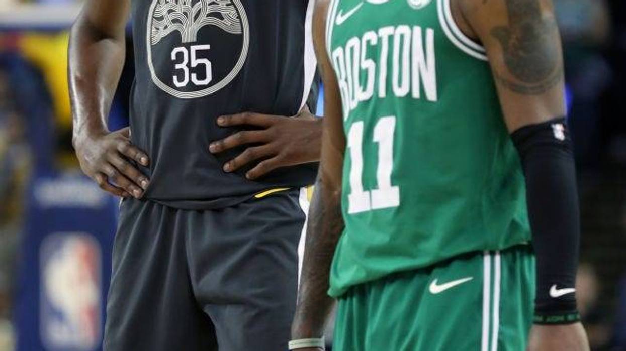 Golden State Warriors' Kevin Durant and Boston Celtics' Kyrie Irving during Warriors' 109-105 win in NBA game at Oracle Arena in Oakland, Calif., on Saturday, January 27, 2018.