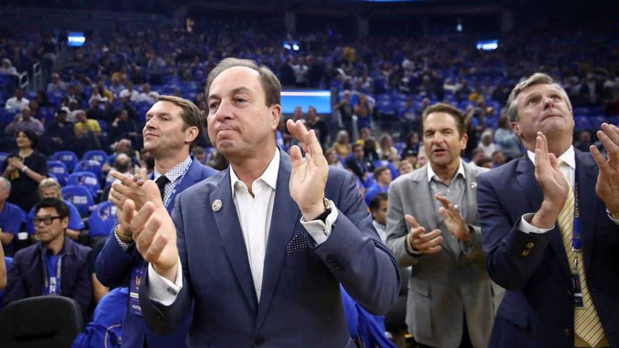 Golden State Warriors owners Joe Lacob and Peter Guber stand with team president and COO Rick Welts before their game against the LA Clippers at Chase Center on October 24, 2019 in San Francisco, California.
